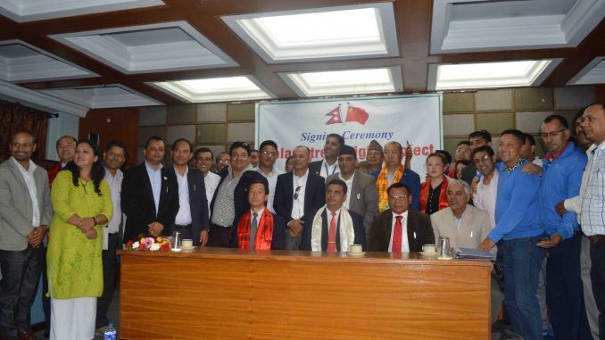 Posing for a group picture during solar light signing ceremony held in Pokhara on Monday. Picture: PCCI